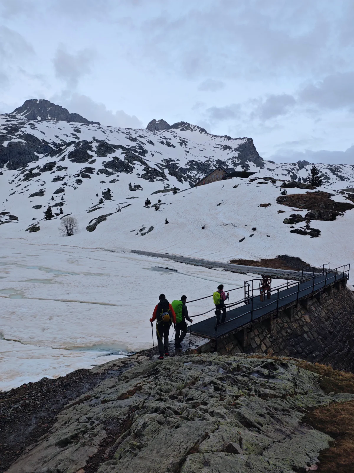 The group crosses a footbridge at the start of the route