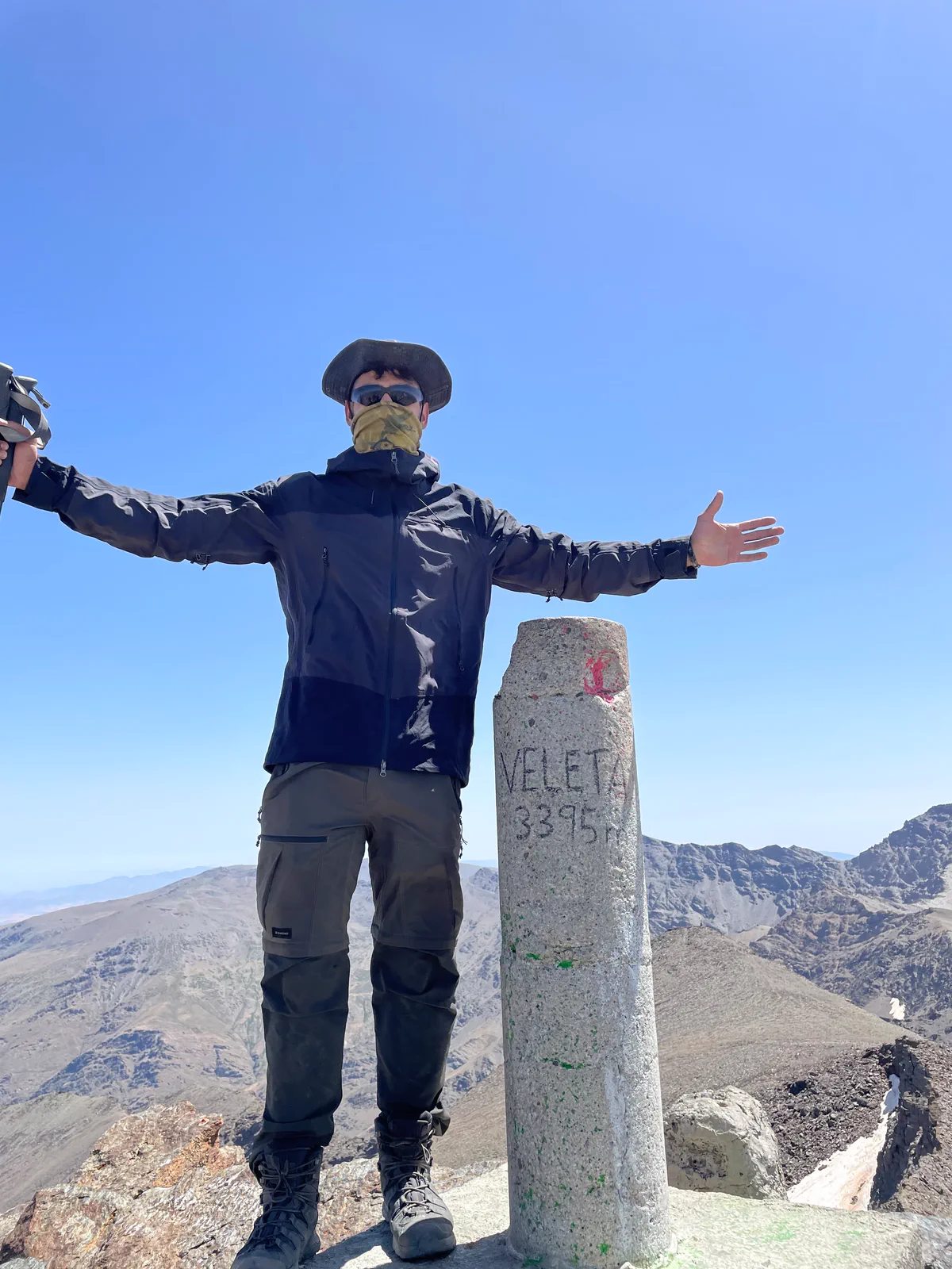Bauti beside the Veleta summit marker during the Integral Sierra Nevada