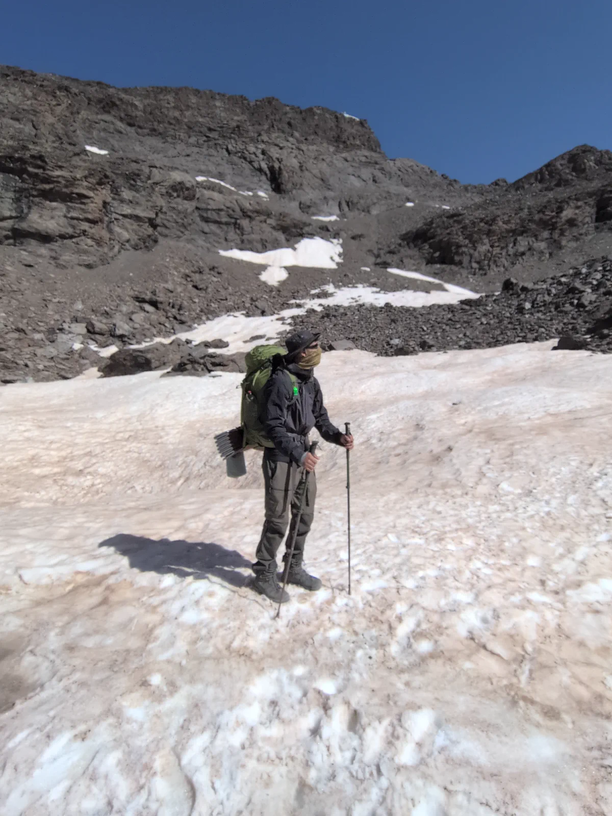 A member of the traverse crosses a Sierra Nevada snowfield