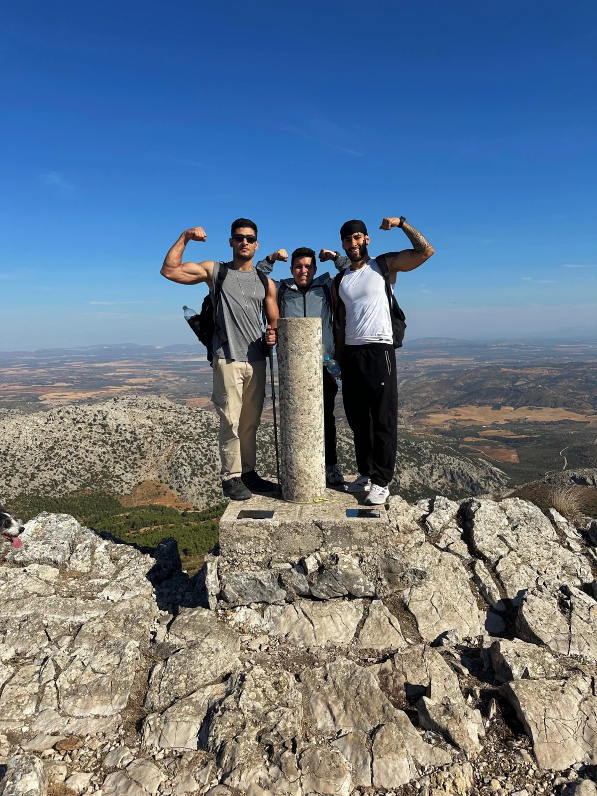 Three members of the group beside the Pico Huma trig point