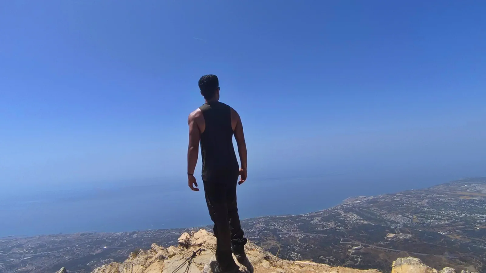Hiker looking across the Costa del Sol from Sierra Blanca