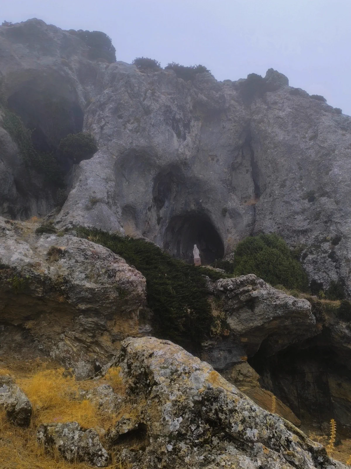 Limestone formations disappearing into the mist