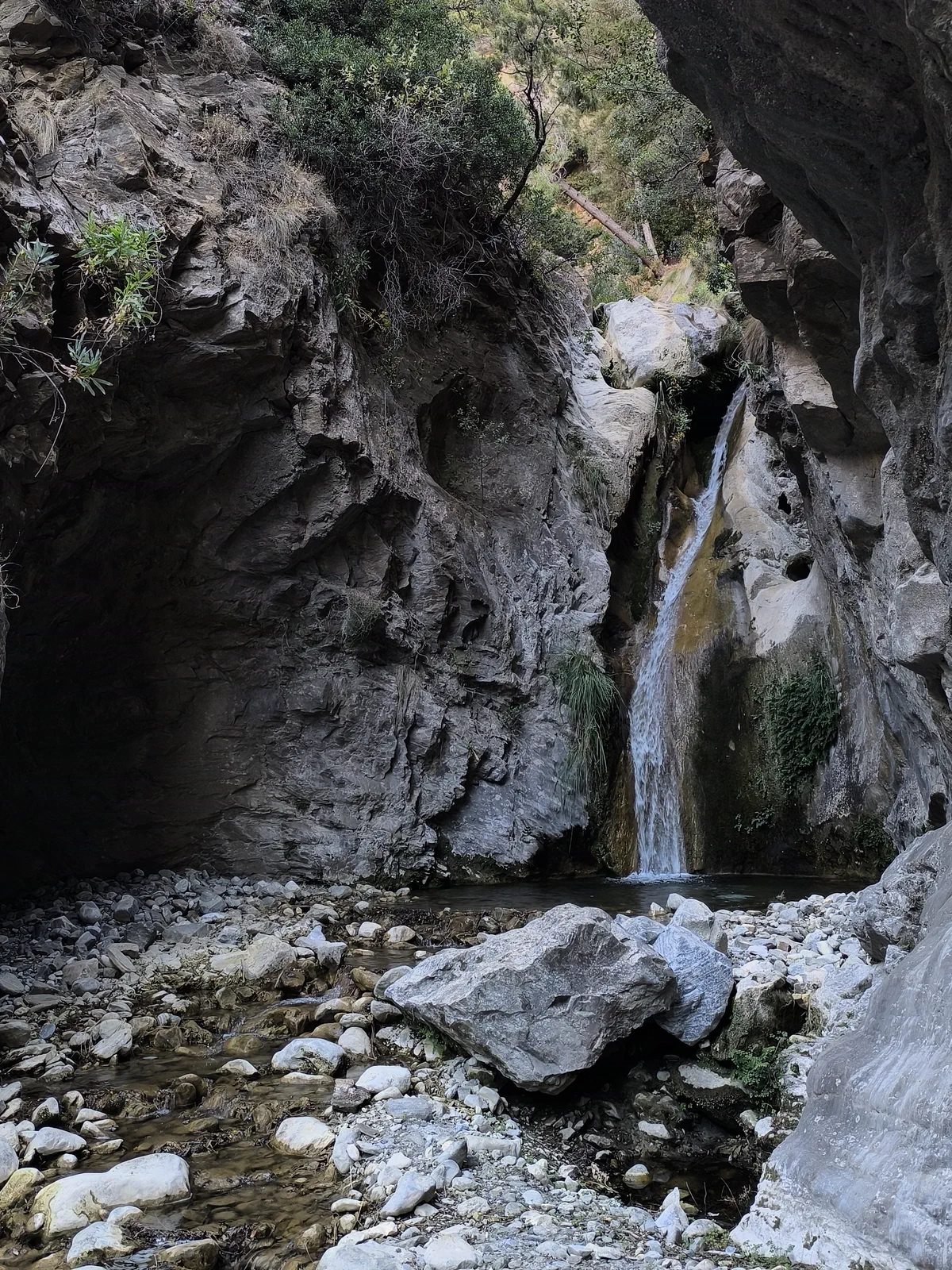 Waterfall enclosed between rock walls