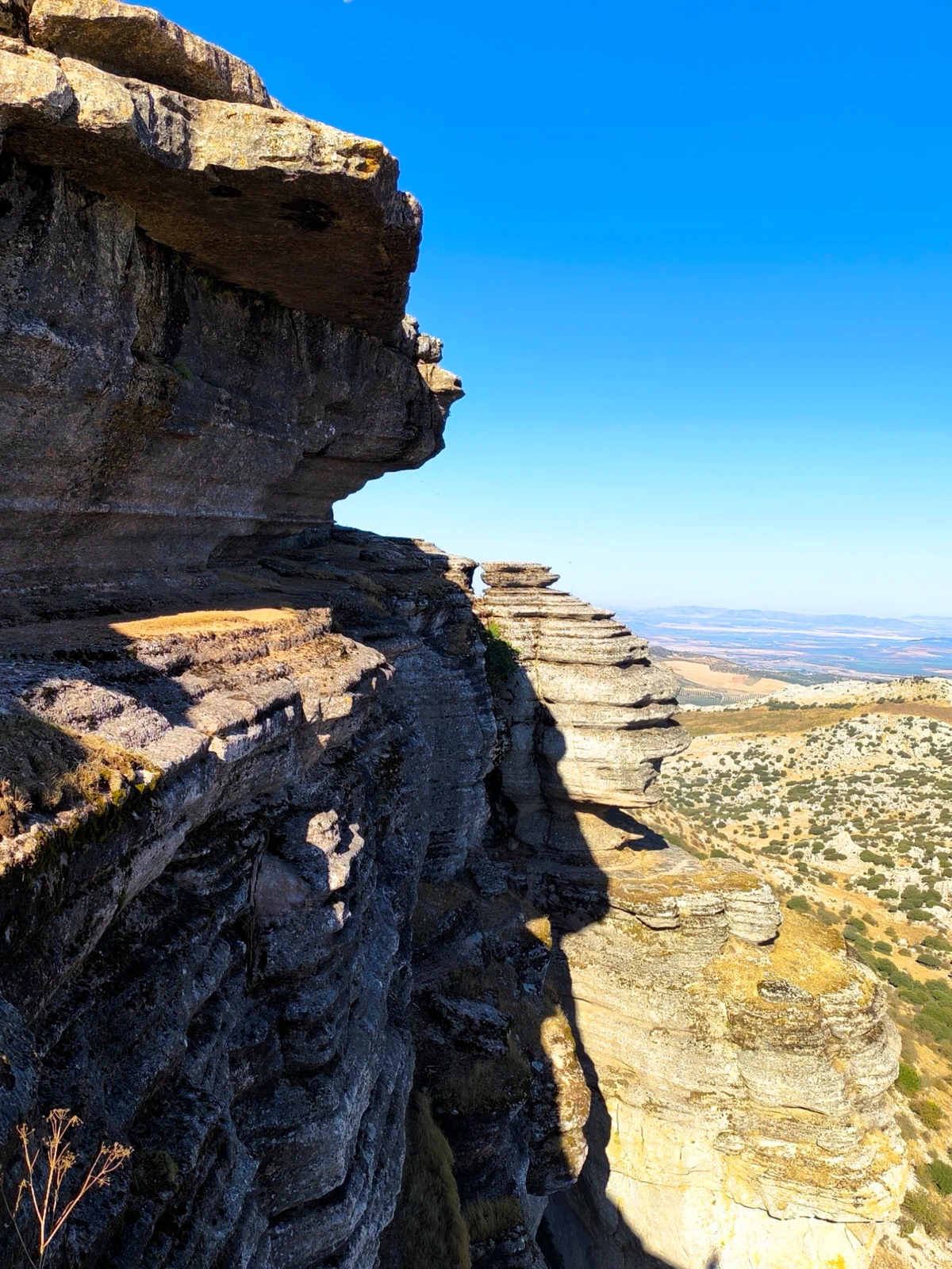 Layered rock ledge above the landscape of Antequera
